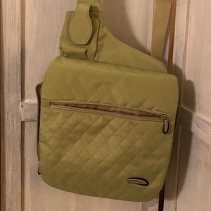 Lime green Travelon bag with accessories.